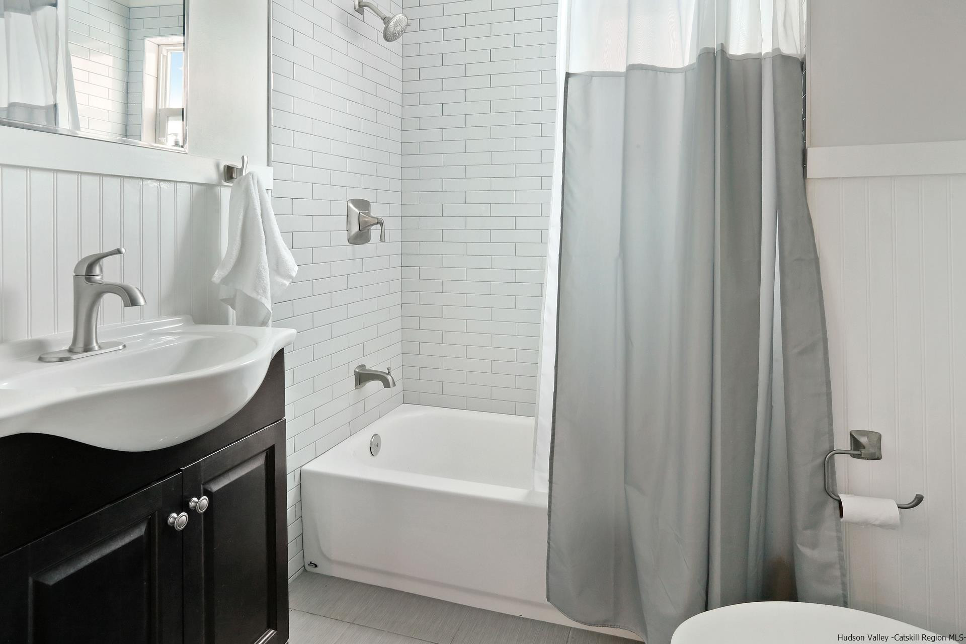 7732 Main Street Hunter, NY 12442 - Photo 15 of 25 a bathroom with a sink vanity mirror and toilet