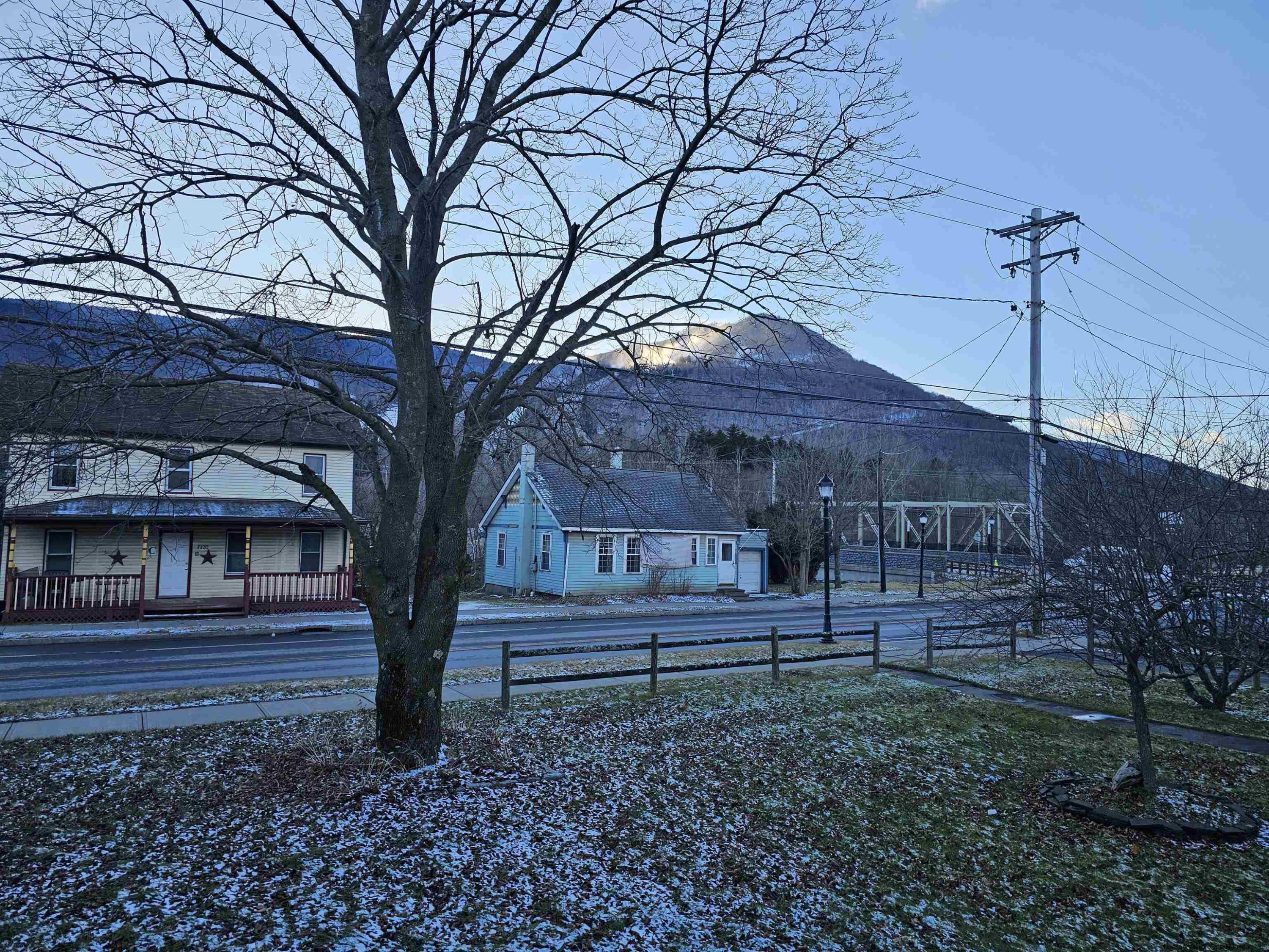 7732 Main Street Hunter, NY 12442 - Photo 22 of 25 a front view of a house with a yard