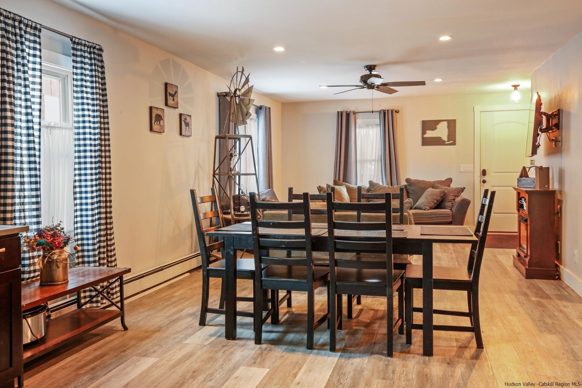 7732 Main Street Hunter, NY 12442 - Photo 7 of 25 a view of a a dining room with furniture window and wooden floor
