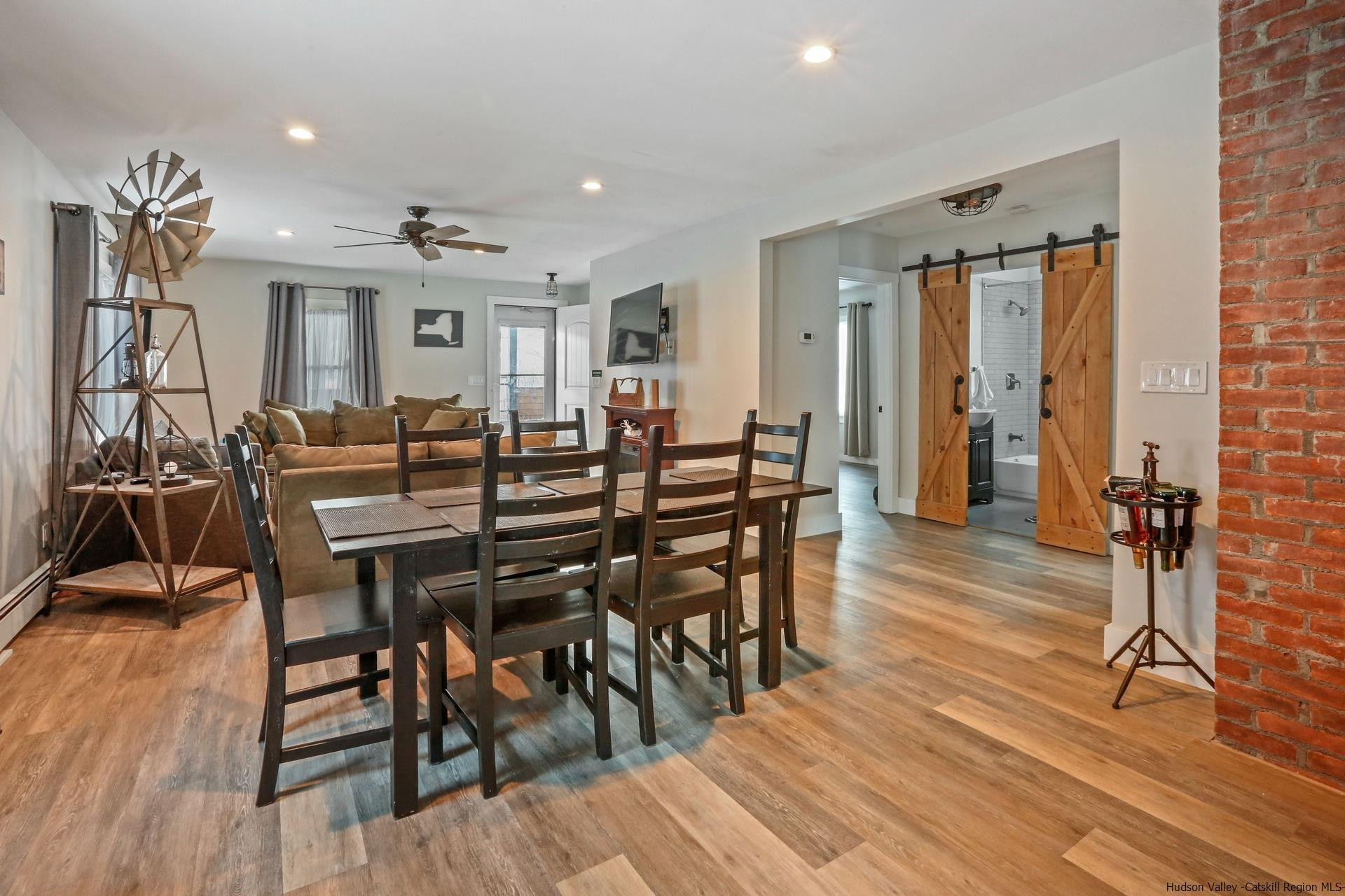 7732 Main Street Hunter, NY 12442 - Photo 8 of 25 a view of a dining room with furniture and wooden floor