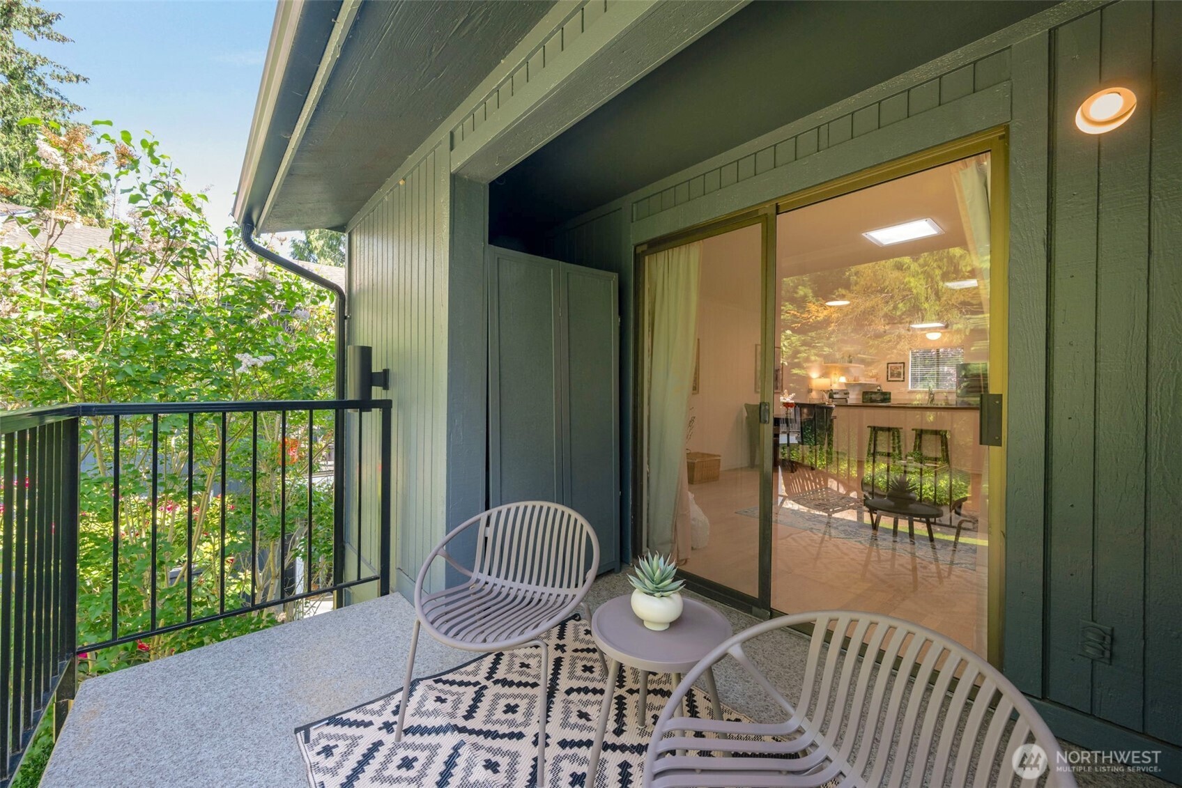 8017 196th Street Southwest, Unit 6B Edmonds, WA 98026 - Photo 6 of 23 a view of a balcony with table and chairs