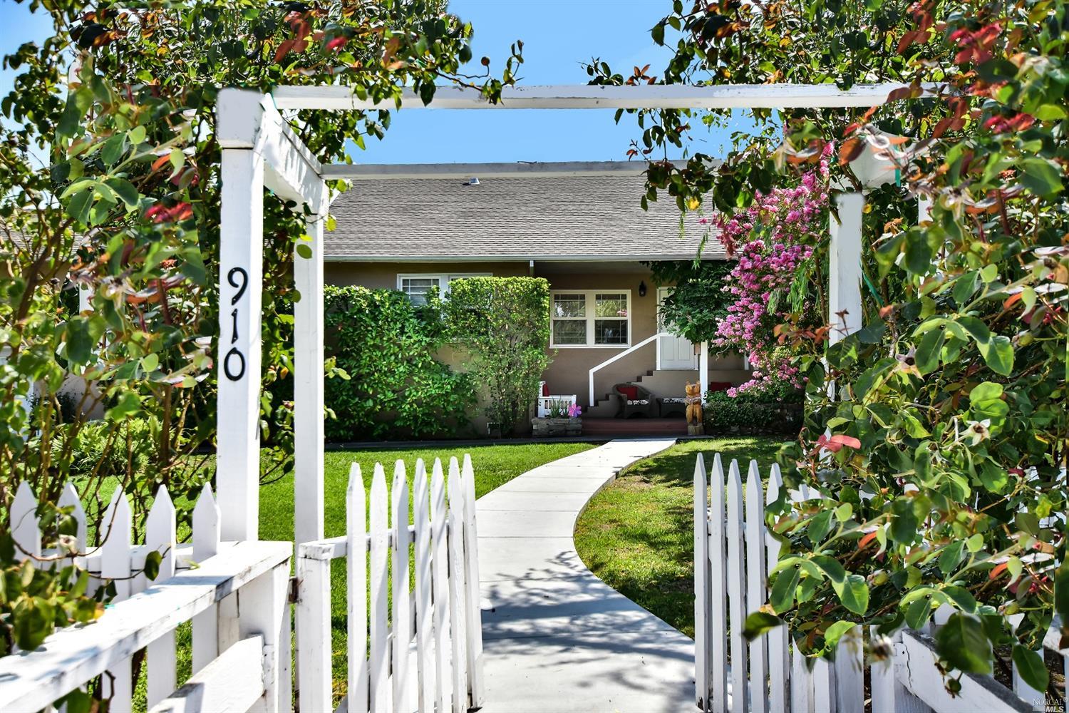 910 Oak Street Sonoma, CA 95476 - Photo 1 of 1 a view of a house with wooden fence next to a yard