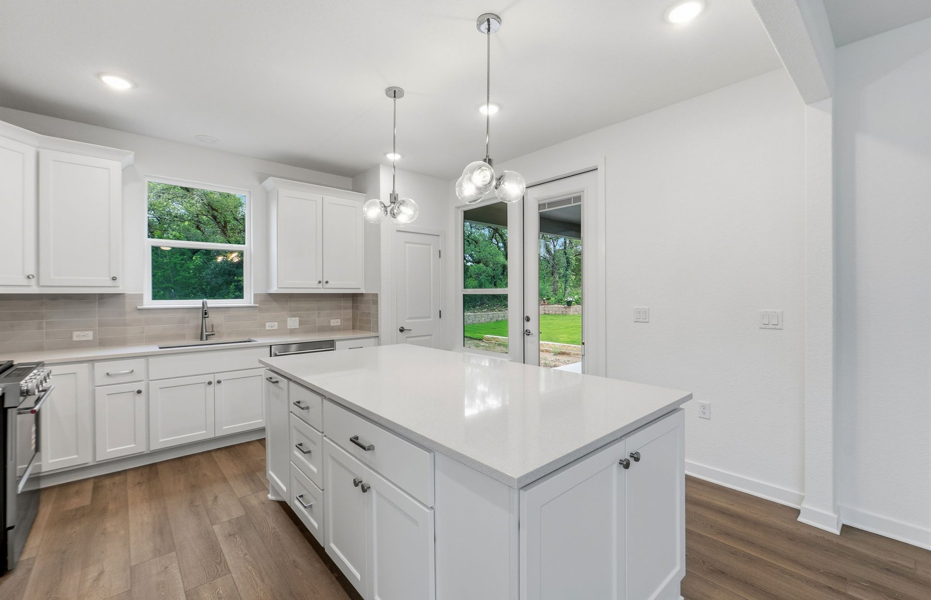 1010 Martingale Street Georgetown, TX 78633 - Photo 4 of 23 a kitchen with a sink window and cabinets
