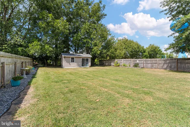 a house view with swimming pool in front of it