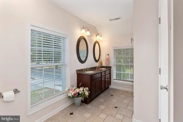 a bathroom with a toilet sink and shower