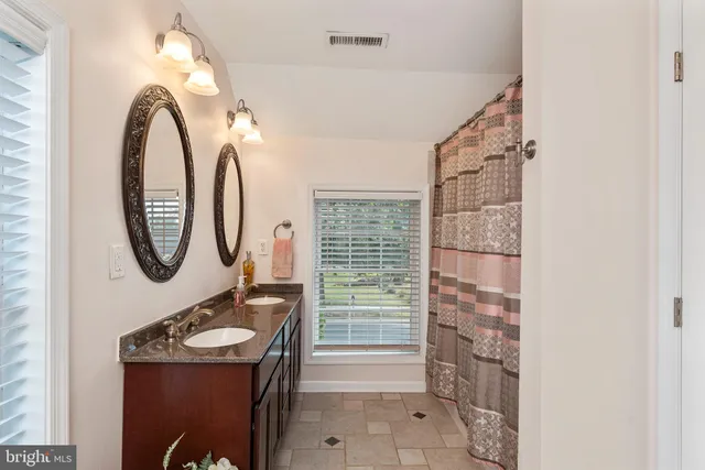 a view of a lake with houses in the background