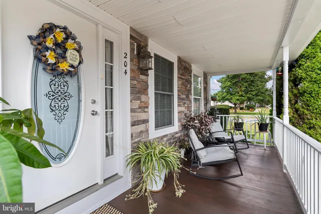 a balcony with furniture and garden view