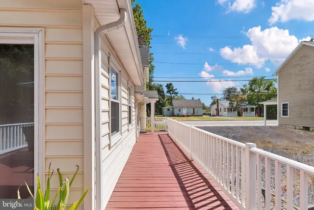a view of a deck with furniture