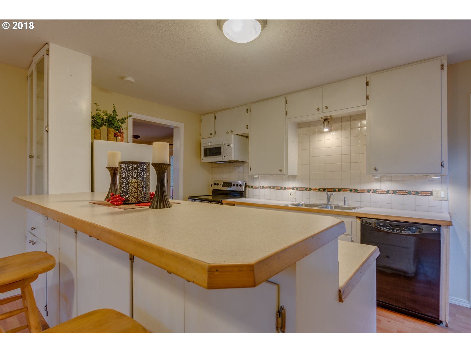 49572 Southwest South Road Gaston, OR 97119 - Photo 13 of 32 a kitchen with kitchen island a stove a sink and a refrigerator