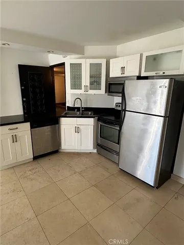 a white refrigerator freezer sitting in a kitchen