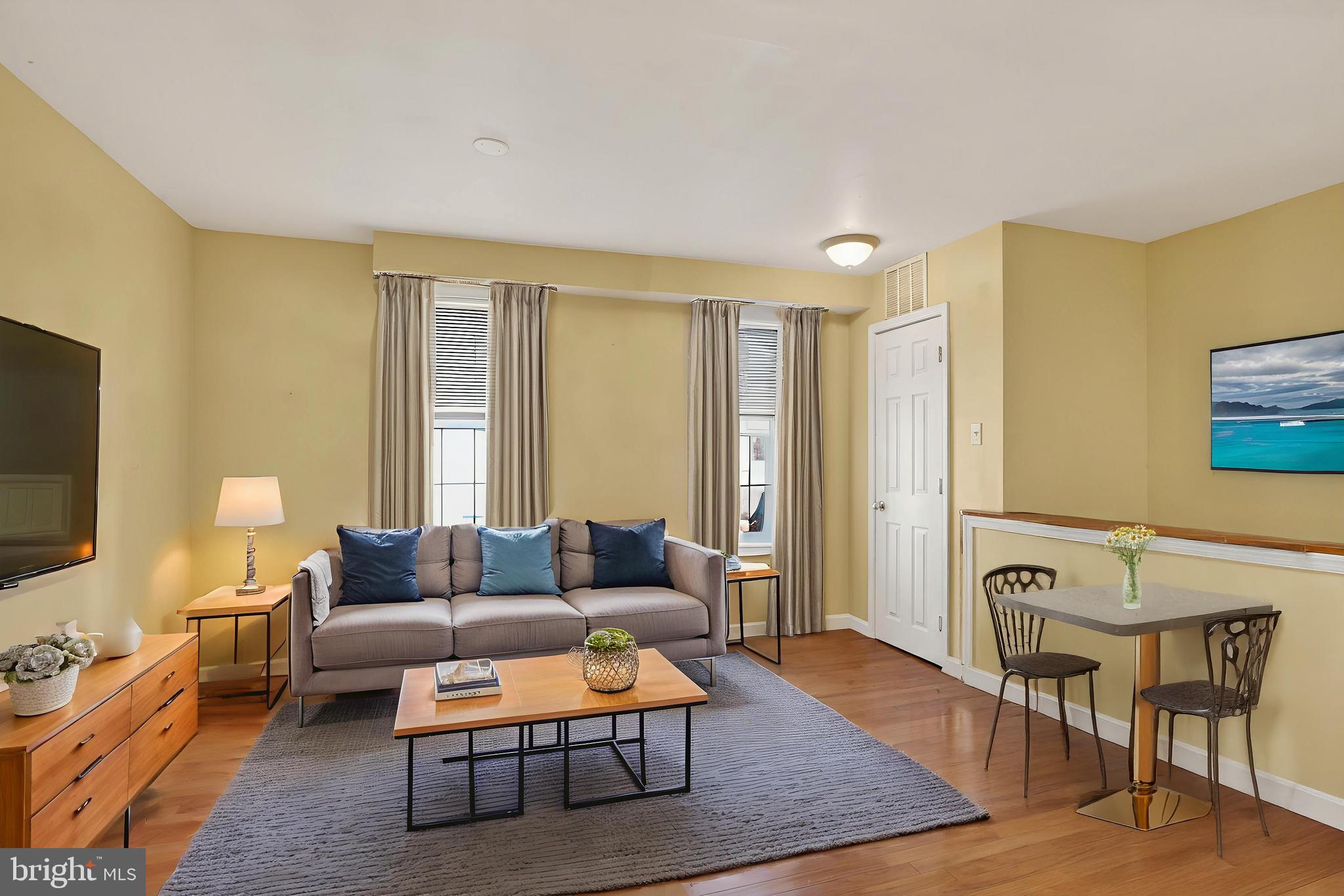 1400 South Chadwick Street, Unit 2 Philadelphia, PA 19146 - Photo 1 of 20 a living room with furniture and a flat screen tv
