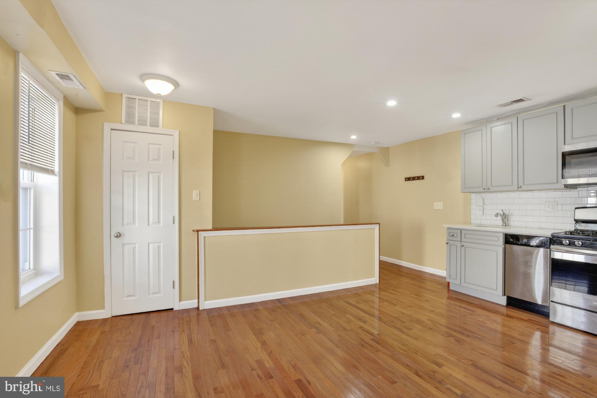 1400 South Chadwick Street, Unit 2 Philadelphia, PA 19146 - Photo 7 of 20 a view of a kitchen with a sink and a refrigerator