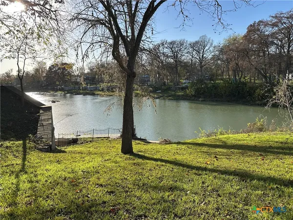 a view of a lake from a yard