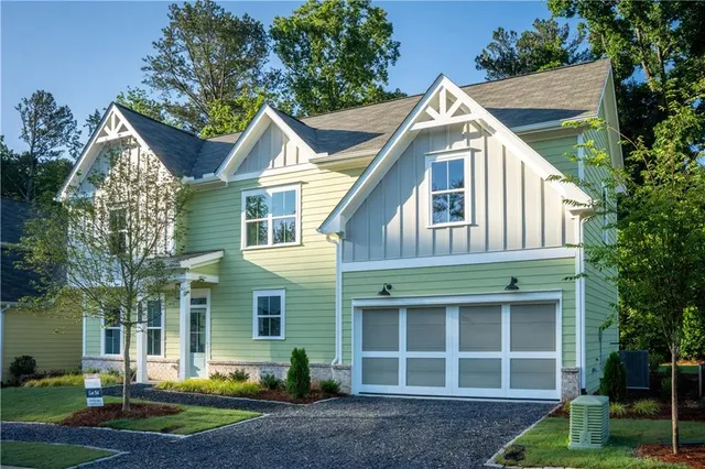 a view of a house with a yard and plants
