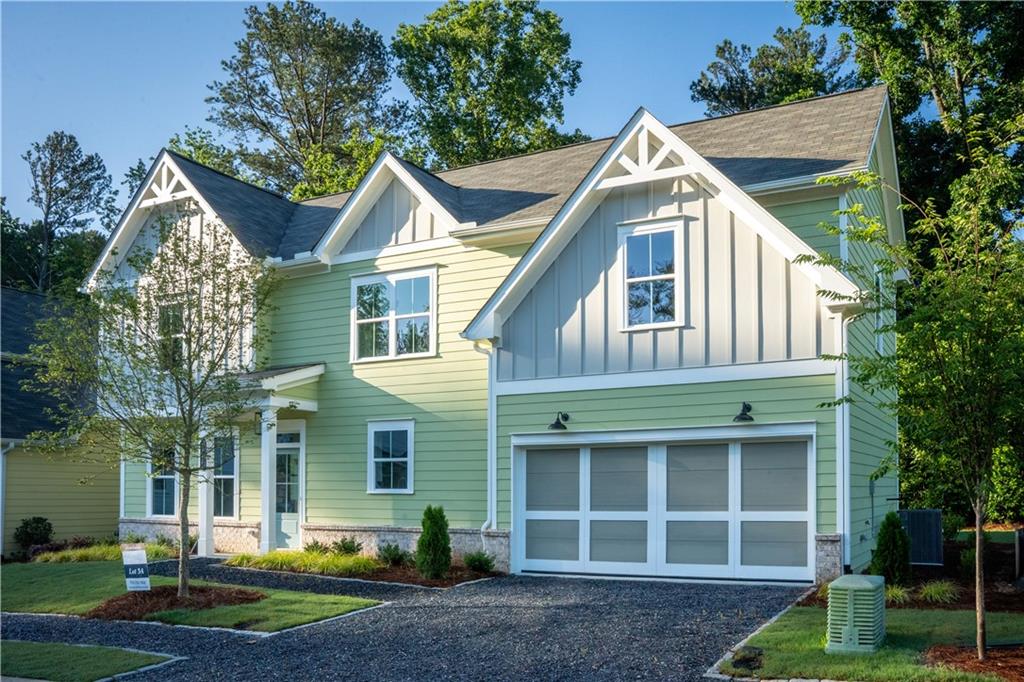a view of a house with a yard and plants