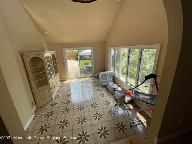 a room with furniture and a large window