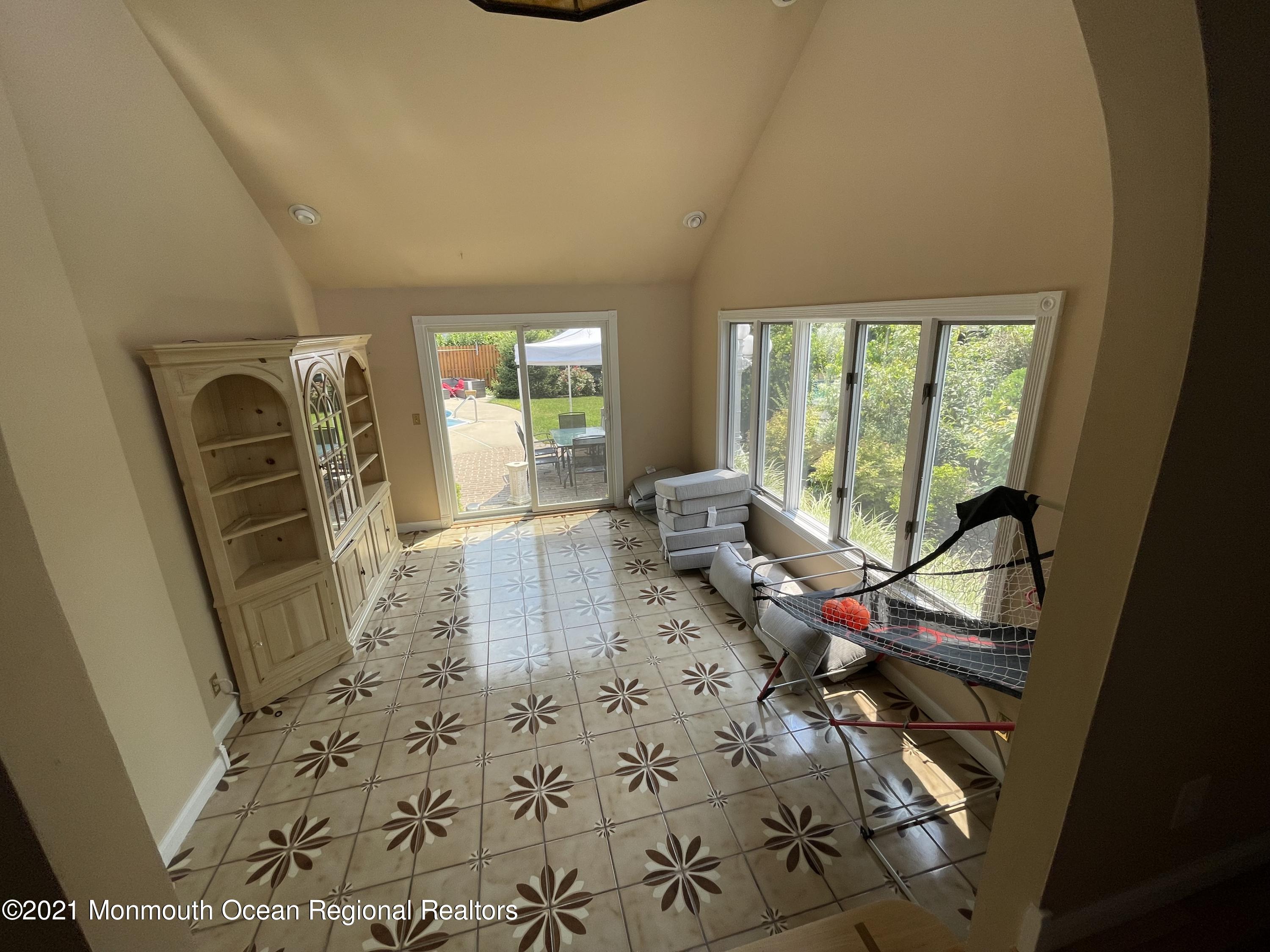 241 Cliftwood Road Oakhurst, NJ 07755 - Photo 12 of 27 a room with furniture and a large window