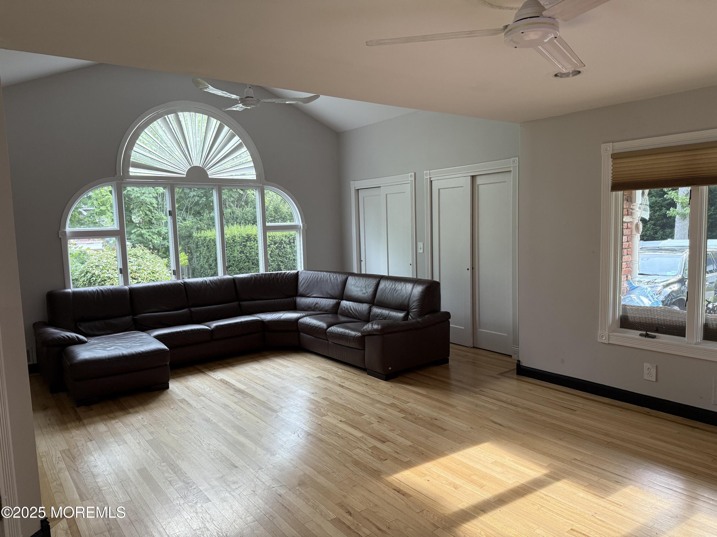 241 Cliftwood Road Oakhurst, NJ 07755 - Photo 13 of 27 a living room with furniture and a large window