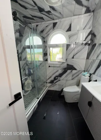 a bathroom with a sink and mirror