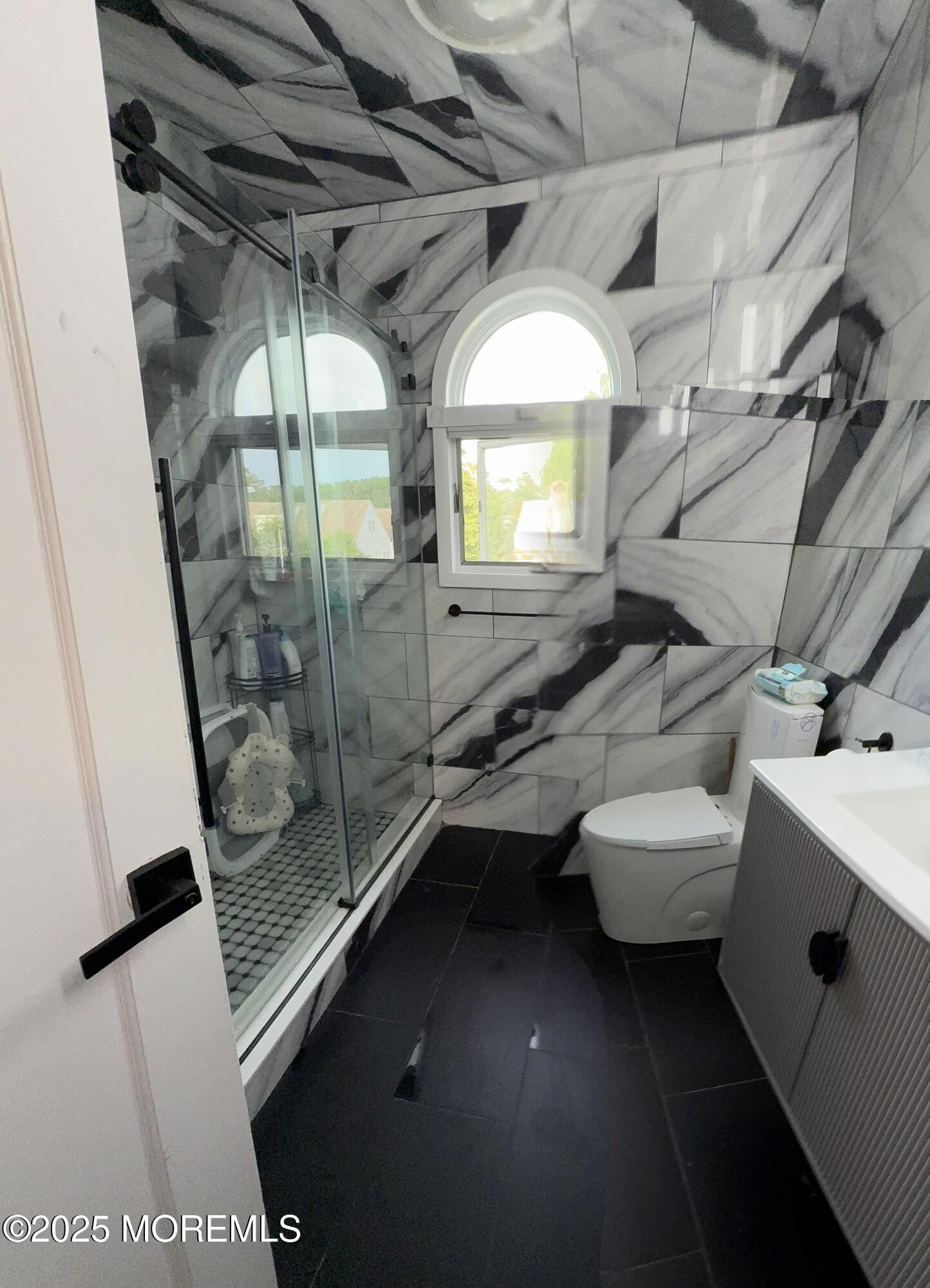 241 Cliftwood Road Oakhurst, NJ 07755 - Photo 17 of 27 a bathroom with a sink and mirror