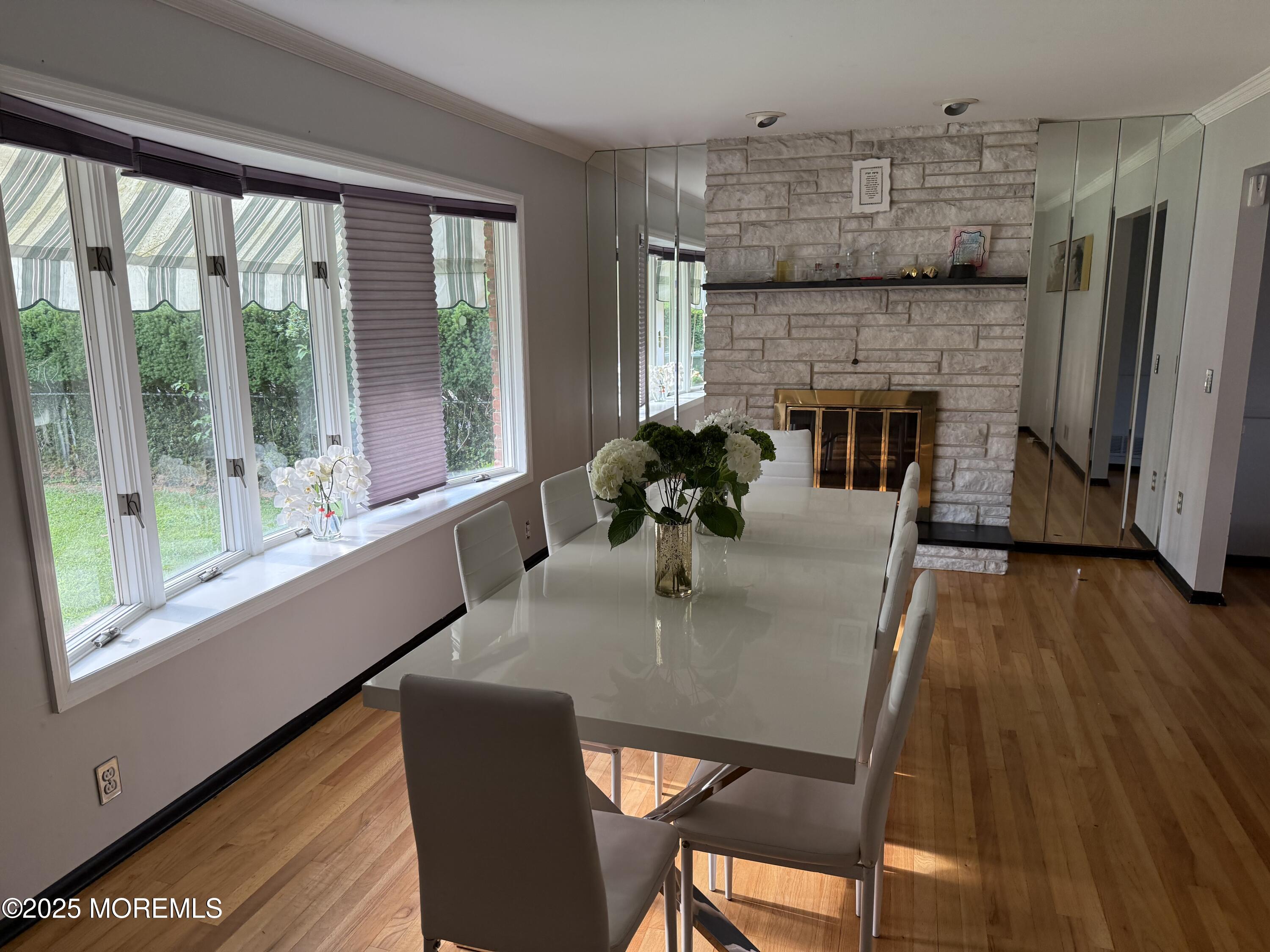 241 Cliftwood Road Oakhurst, NJ 07755 - Photo 2 of 27 a dining room with furniture window and wooden floor