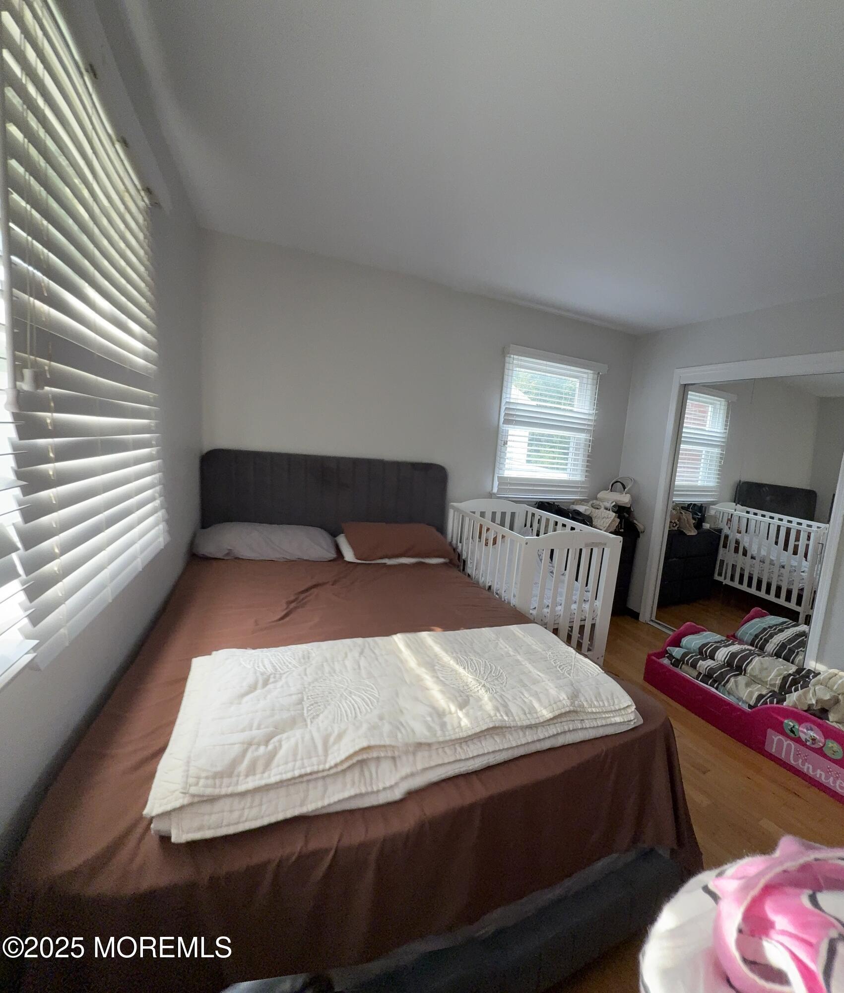 241 Cliftwood Road Oakhurst, NJ 07755 - Photo 22 of 27 a bedroom with a bed and window
