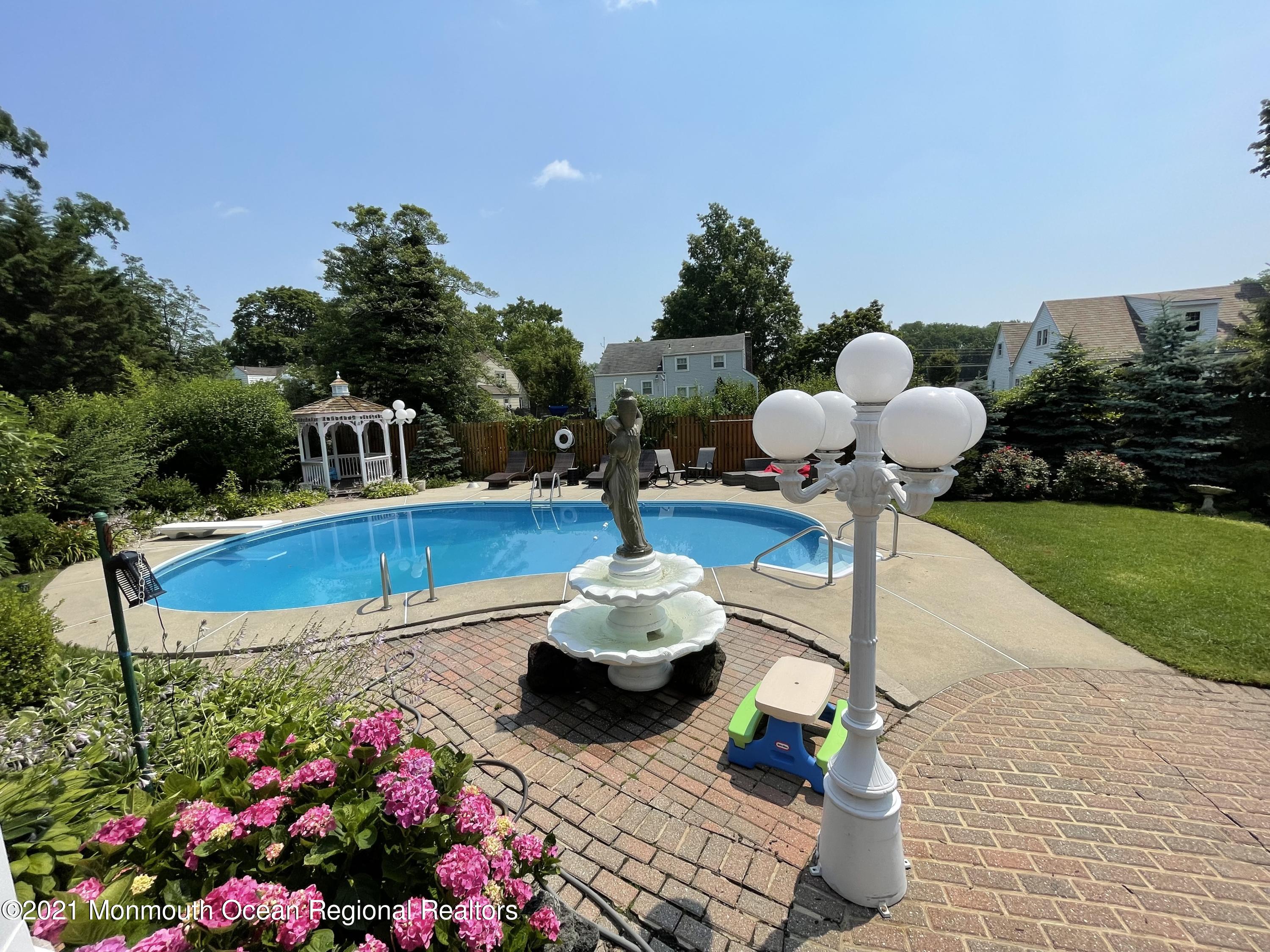 241 Cliftwood Road Oakhurst, NJ 07755 - Photo 26 of 27 a swimming pool with plants