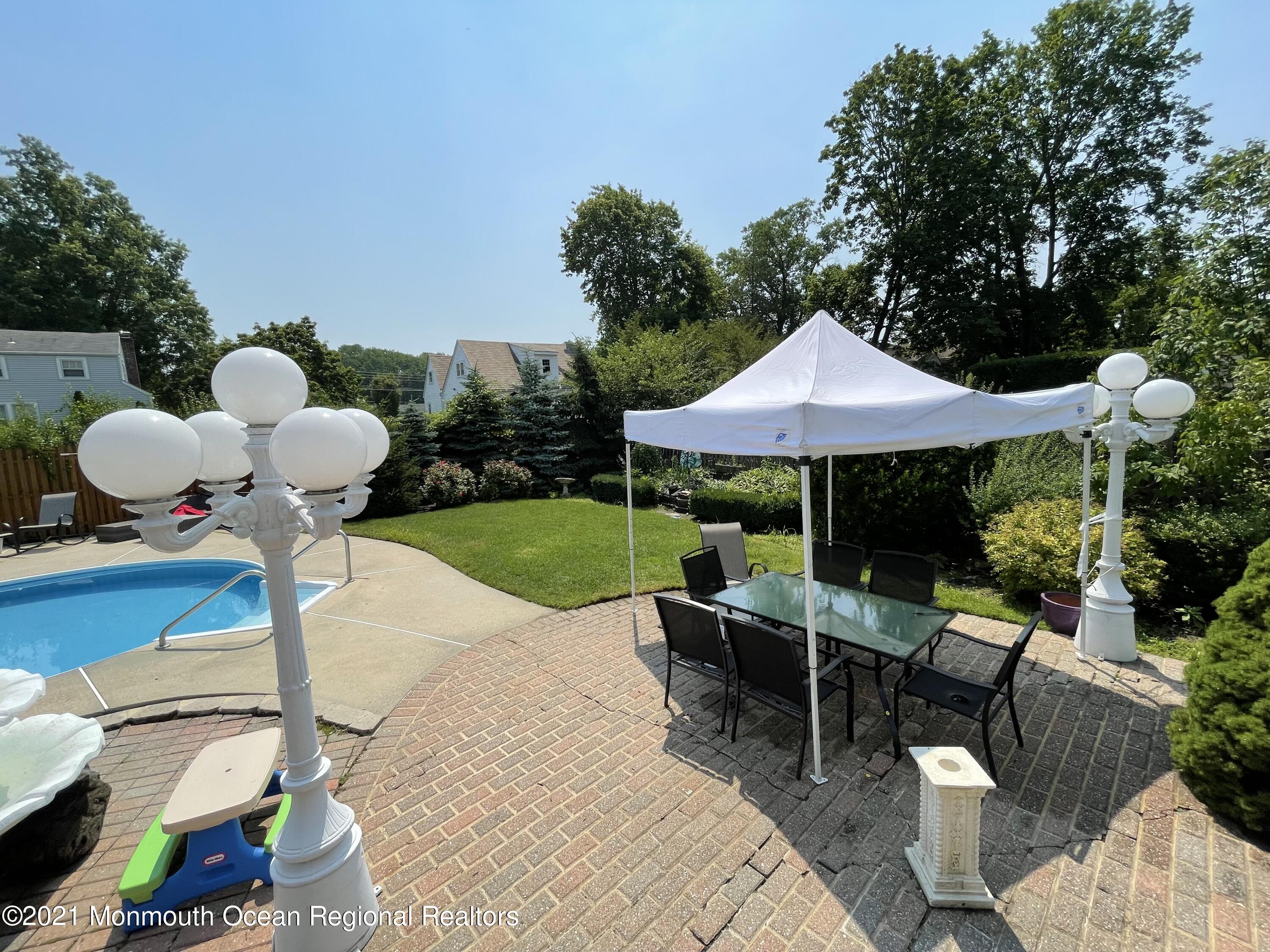 241 Cliftwood Road Oakhurst, NJ 07755 - Photo 27 of 27 a backyard view with a seating space