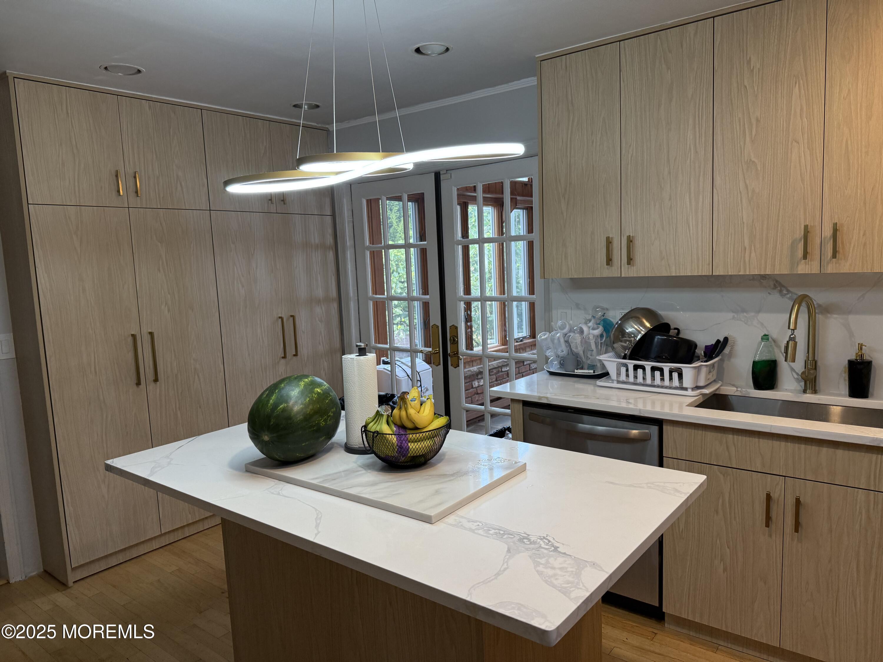 241 Cliftwood Road Oakhurst, NJ 07755 - Photo 7 of 27 a kitchen with a sink a stove and cabinets