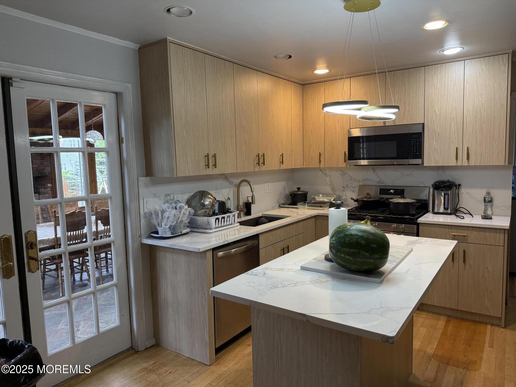 241 Cliftwood Road Oakhurst, NJ 07755 - Photo 8 of 27 a kitchen with a sink a stove and cabinets