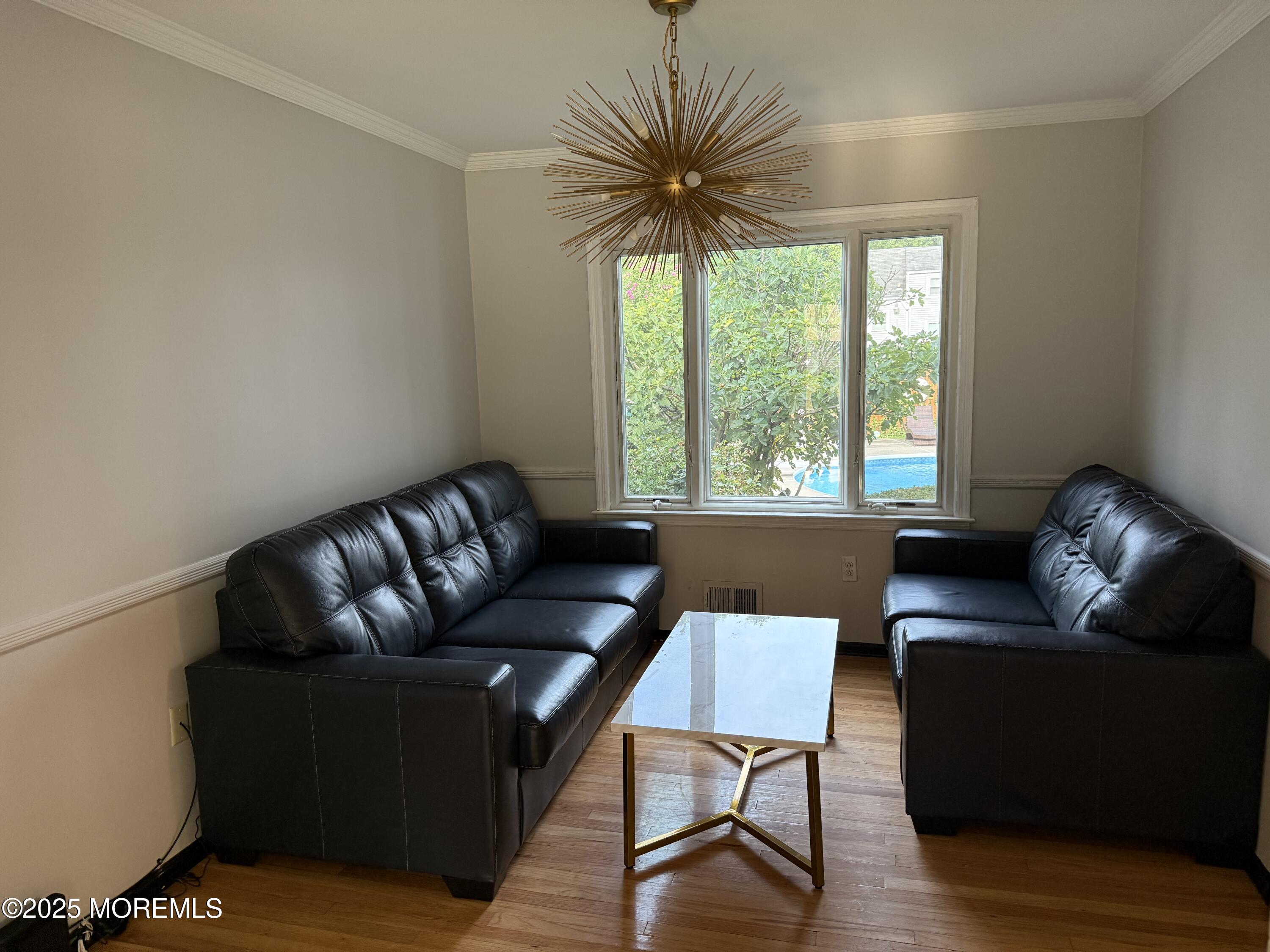241 Cliftwood Road Oakhurst, NJ 07755 - Photo 10 of 27 a living room with furniture and a large window