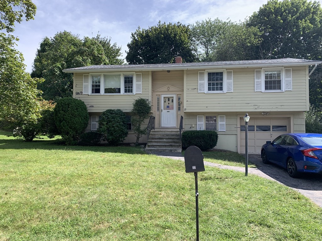 22 Redman Road Canton, MA 02021 - Photo 1 of 13 a front view of a house with garden