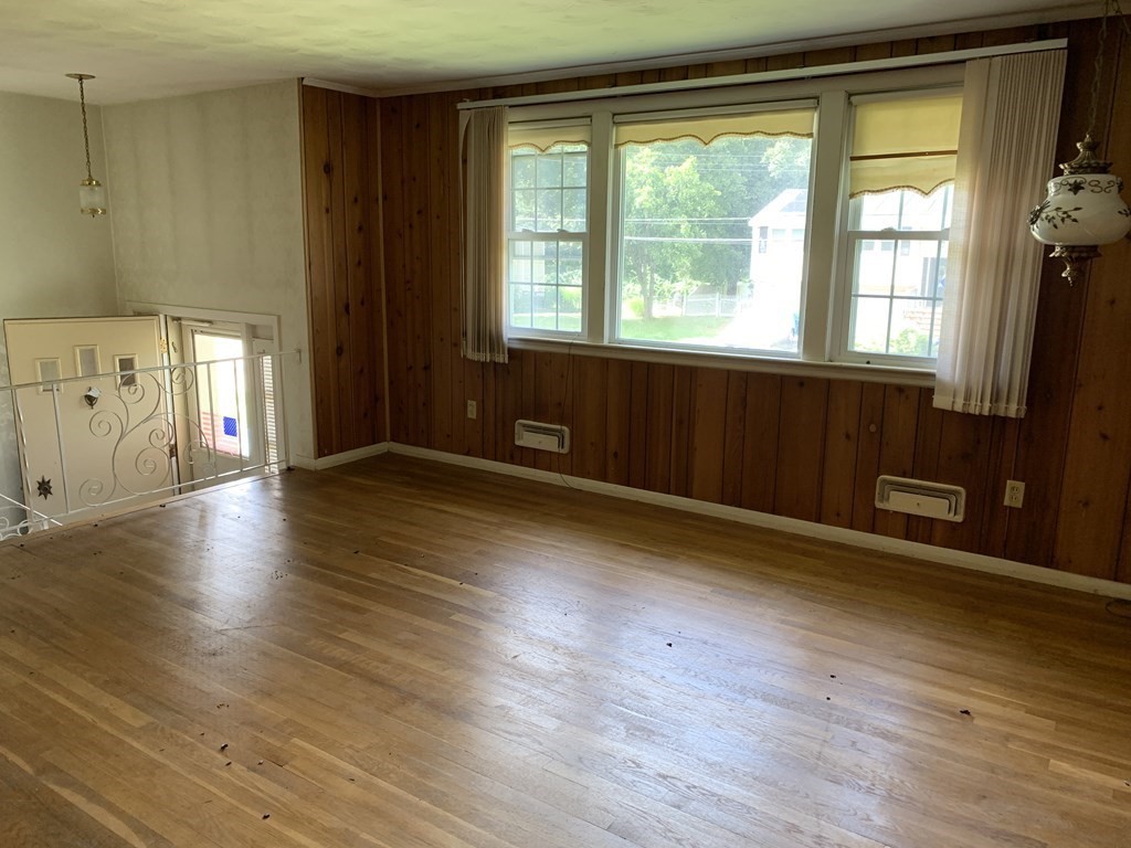22 Redman Road Canton, MA 02021 - Photo 3 of 13 a view of an empty room with wooden floor and a window