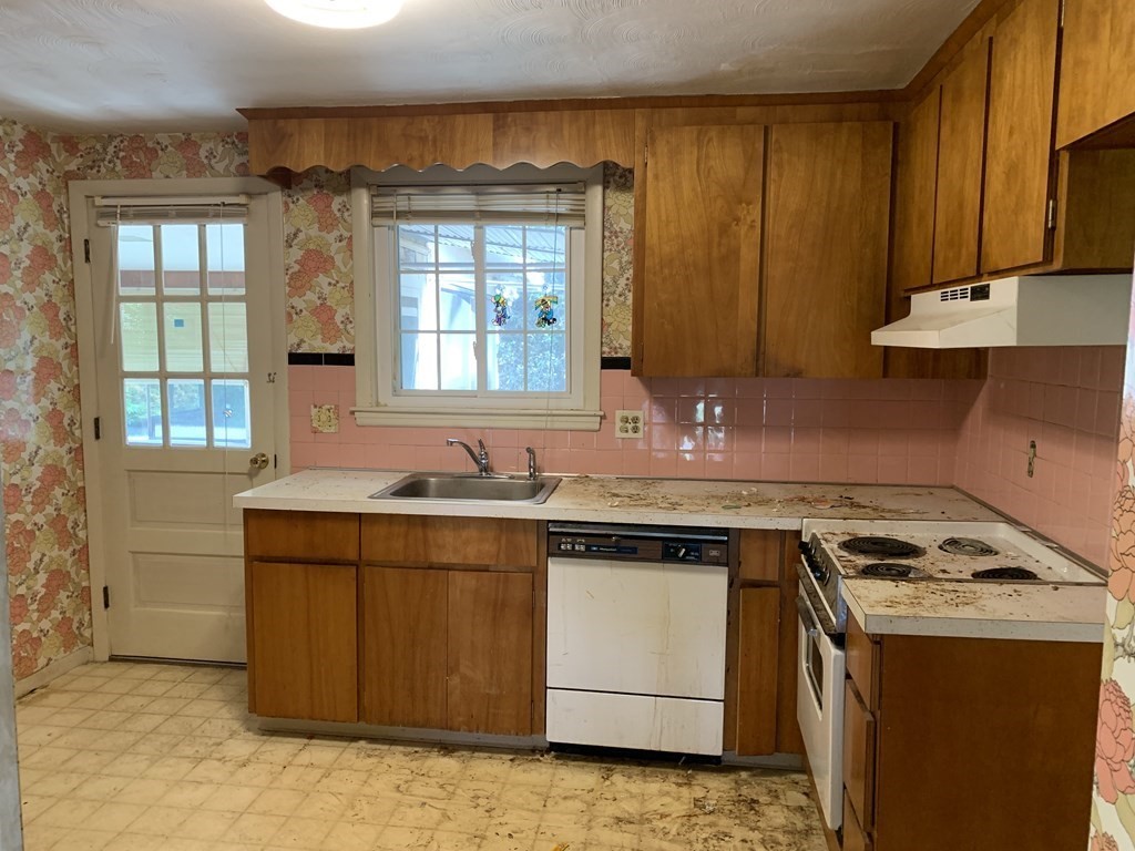 22 Redman Road Canton, MA 02021 - Photo 5 of 13 a kitchen with a stove a sink and a microwave