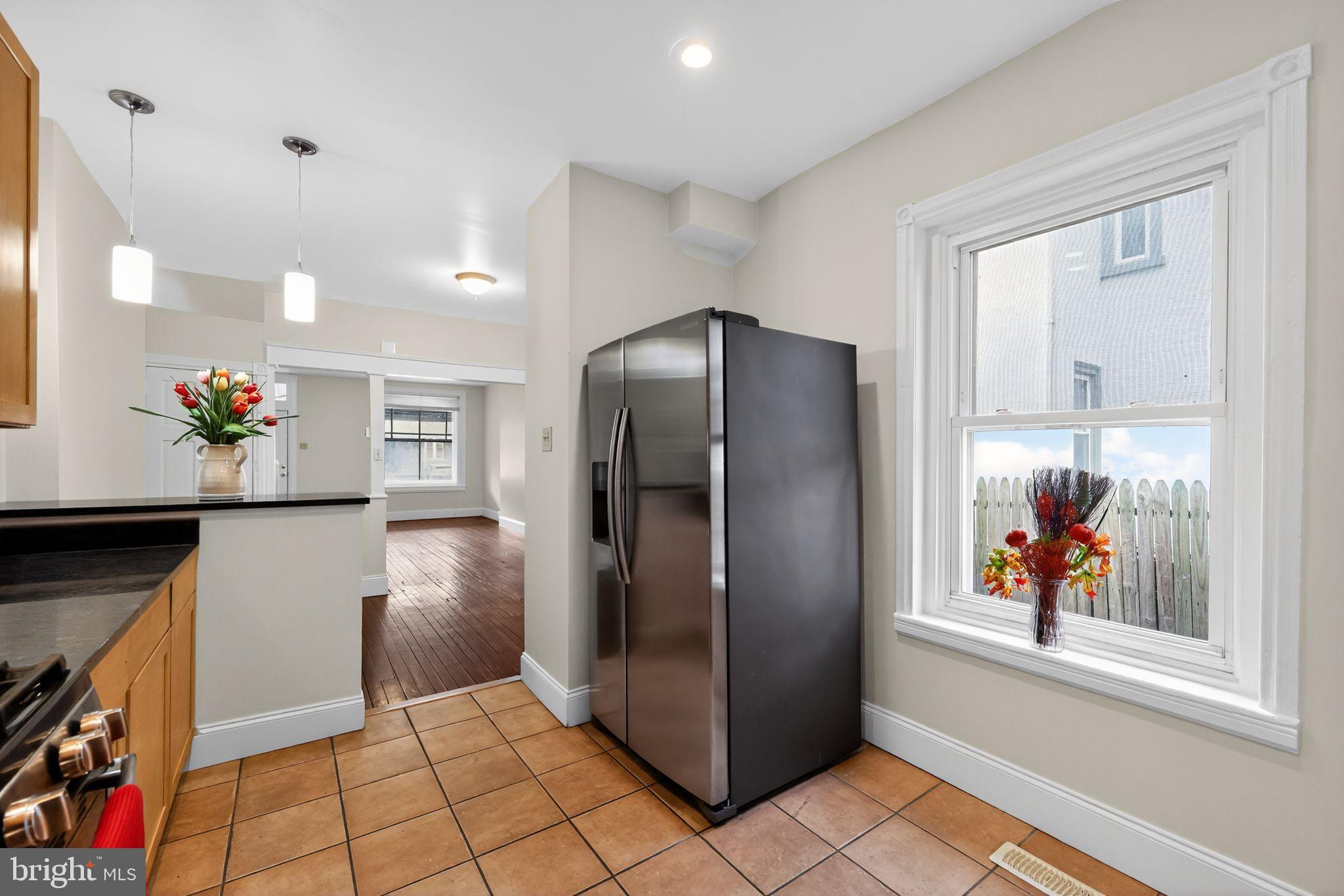 5443 Morris Street Philadelphia, PA 19144 - Photo 15 of 37 a view of kitchen with stainless steel appliances granite countertop a refrigerator and a counter top space