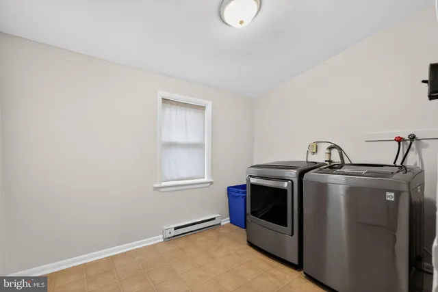 a view of a kitchen with a stove top oven