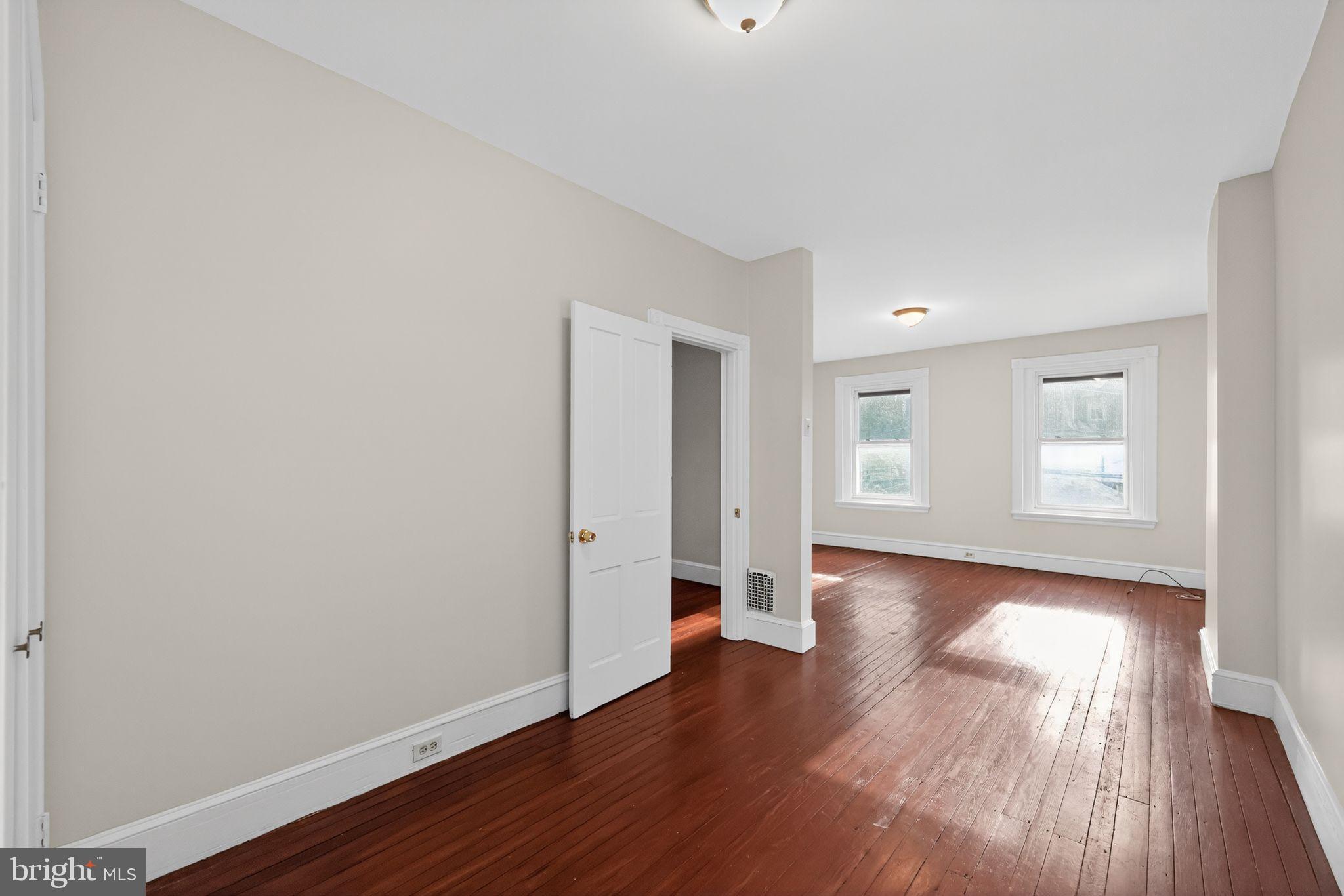 5443 Morris Street Philadelphia, PA 19144 - Photo 22 of 37 a view of a big room with wooden floor and windows