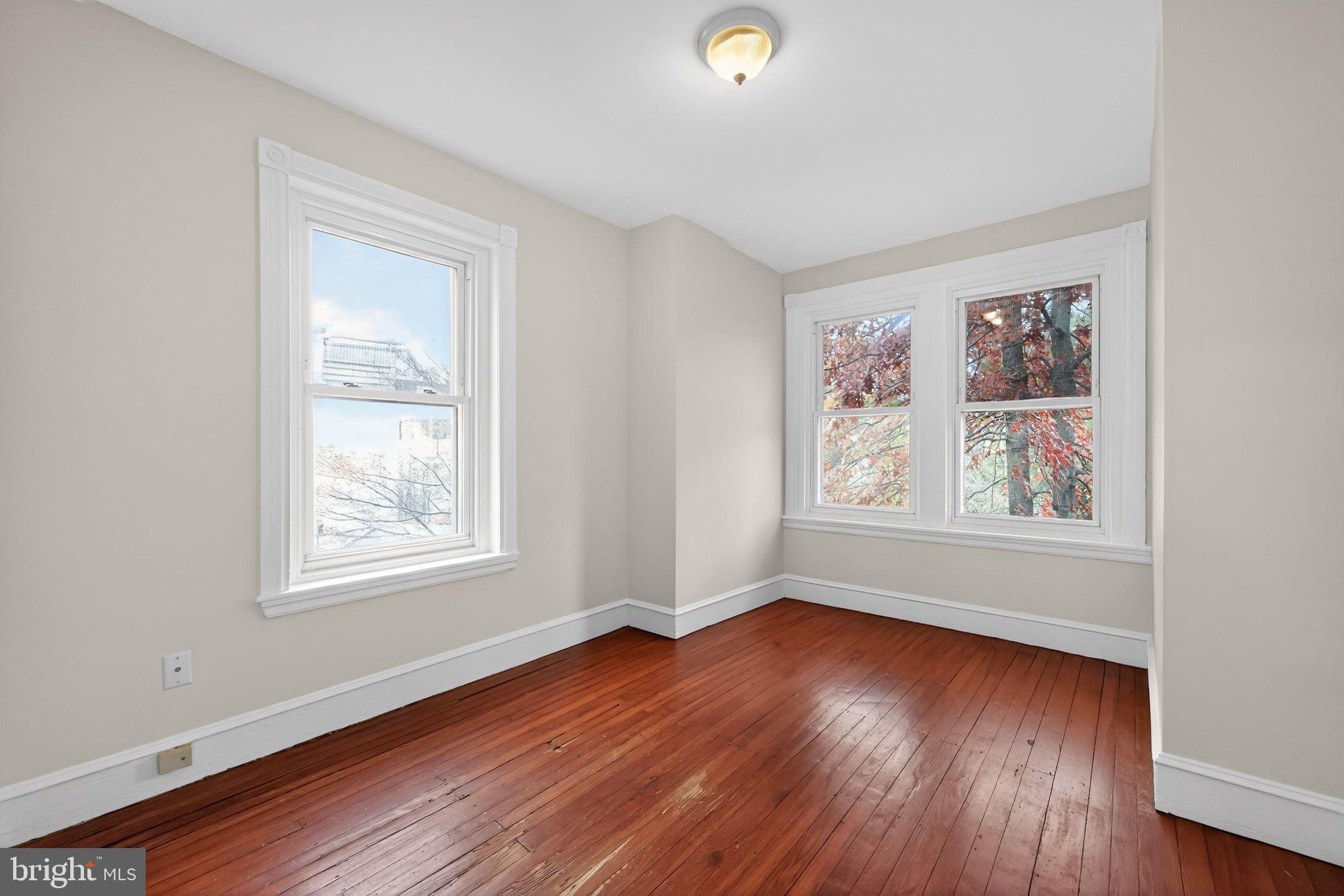 5443 Morris Street Philadelphia, PA 19144 - Photo 26 of 37 an empty room with wooden floor and windows