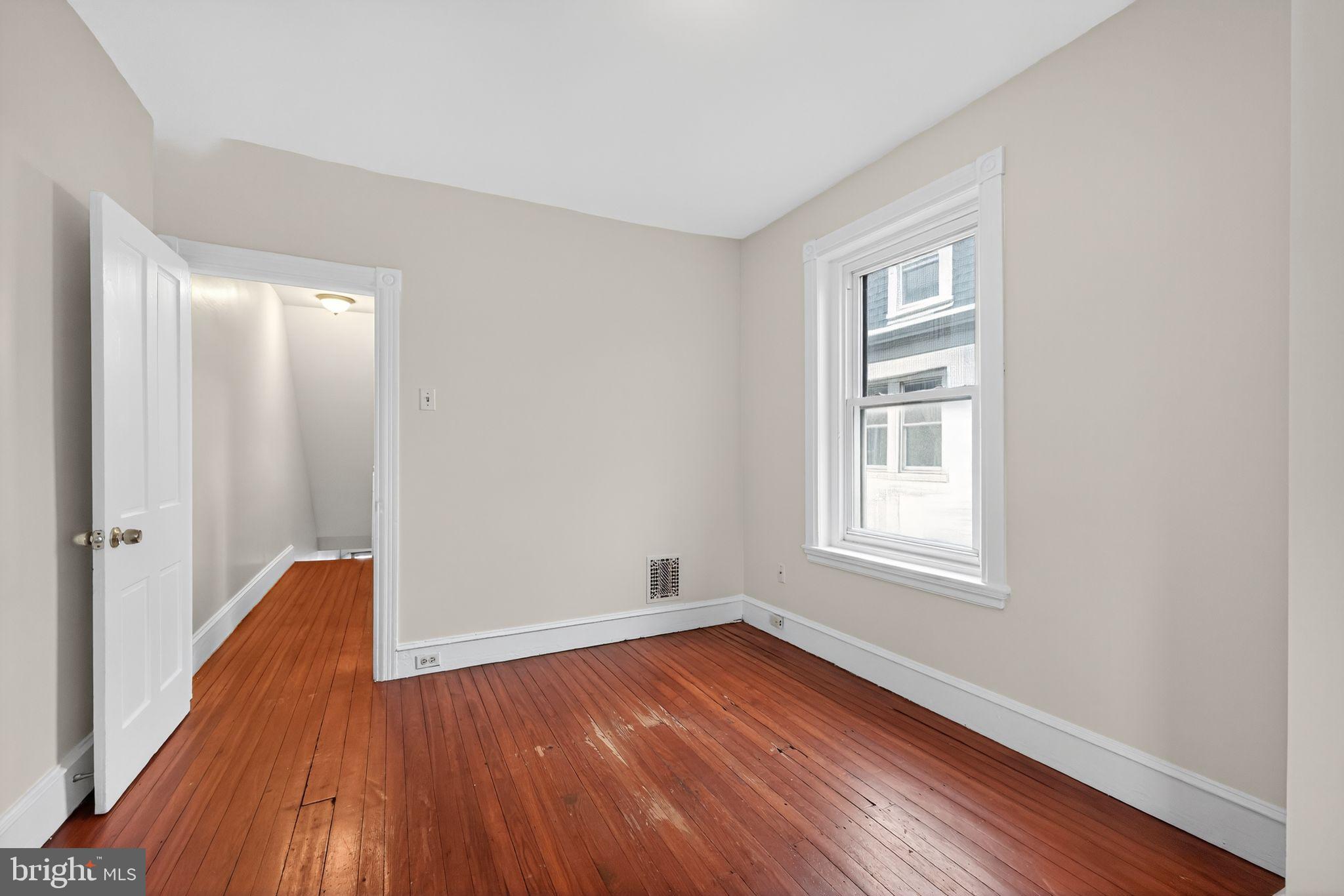 5443 Morris Street Philadelphia, PA 19144 - Photo 27 of 37 an empty room with wooden floor and windows