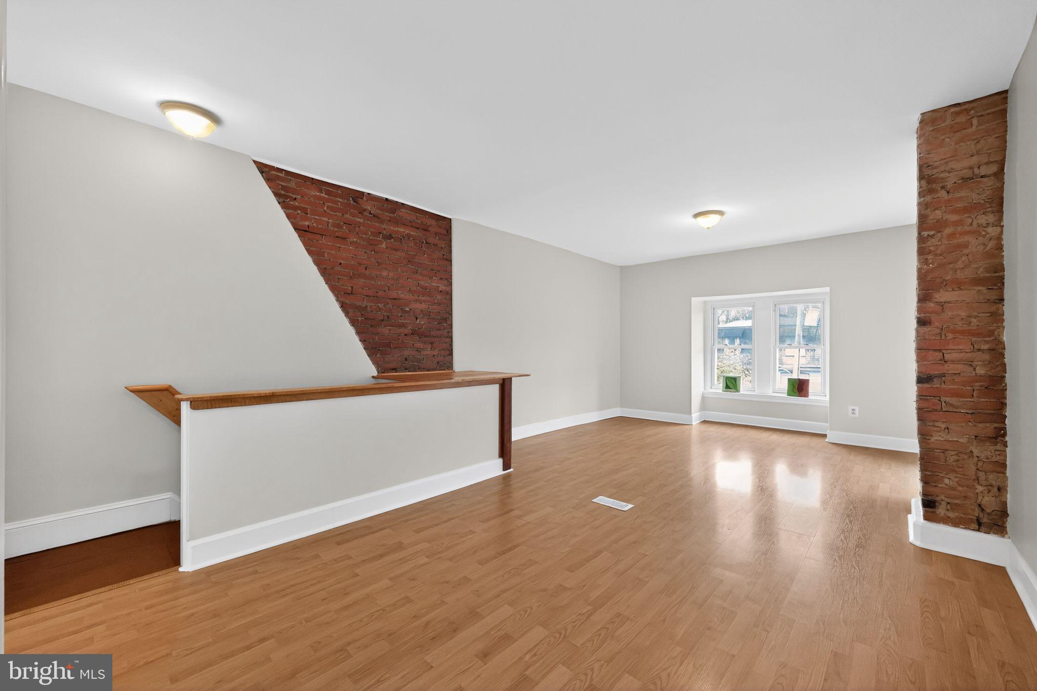5443 Morris Street Philadelphia, PA 19144 - Photo 29 of 37 a view of an empty room with wooden floor and a window