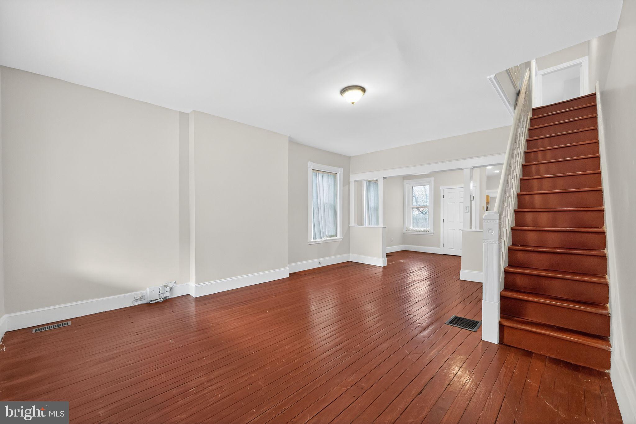 5443 Morris Street Philadelphia, PA 19144 - Photo 6 of 37 wooden floor in an empty room with a window