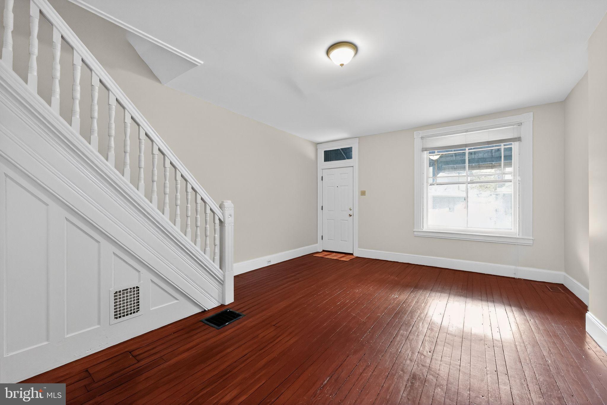 5443 Morris Street Philadelphia, PA 19144 - Photo 8 of 37 a view of an empty room with wooden floor and a window