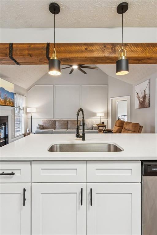 5595 Vaughn Road Woodstock, GA 30188 - Photo 16 of 42 a kitchen with a sink and cabinets