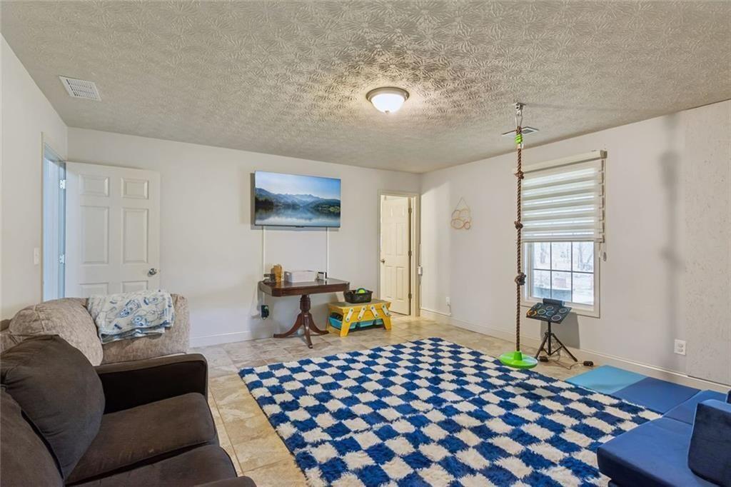 5595 Vaughn Road Woodstock, GA 30188 - Photo 28 of 42 a living room with furniture