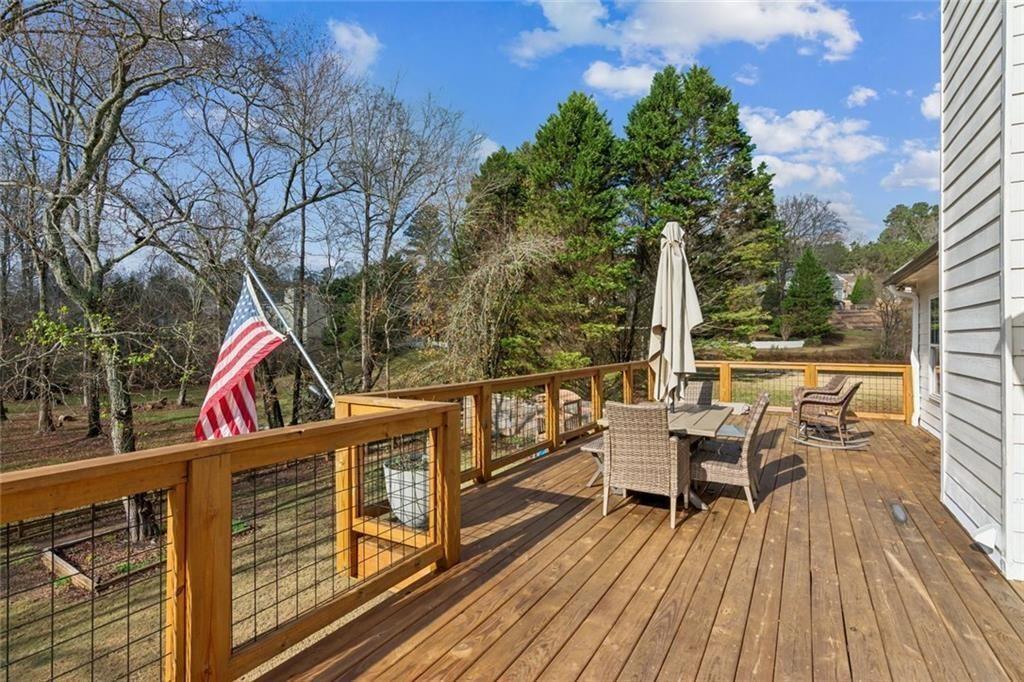 5595 Vaughn Road Woodstock, GA 30188 - Photo 32 of 42 a view of roof deck with patio