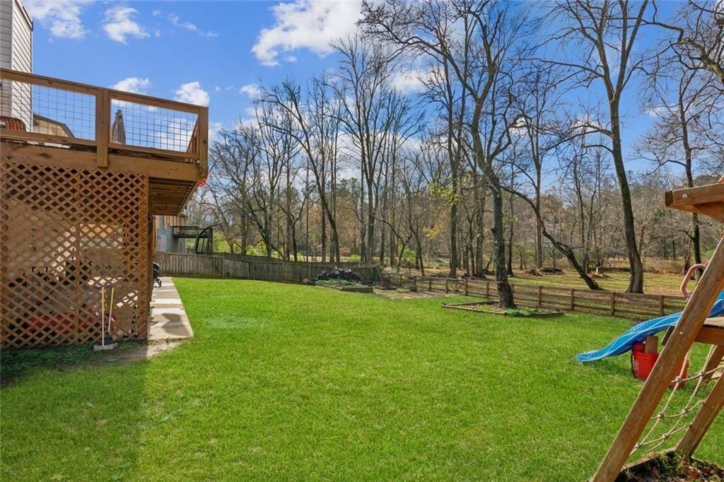 5595 Vaughn Road Woodstock, GA 30188 - Photo 38 of 42 a view of a park with large trees