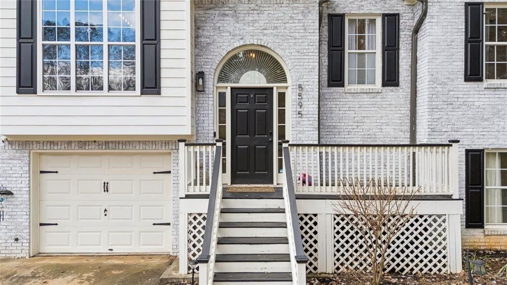 5595 Vaughn Road Woodstock, GA 30188 - Photo 4 of 42 front view of a house with a window