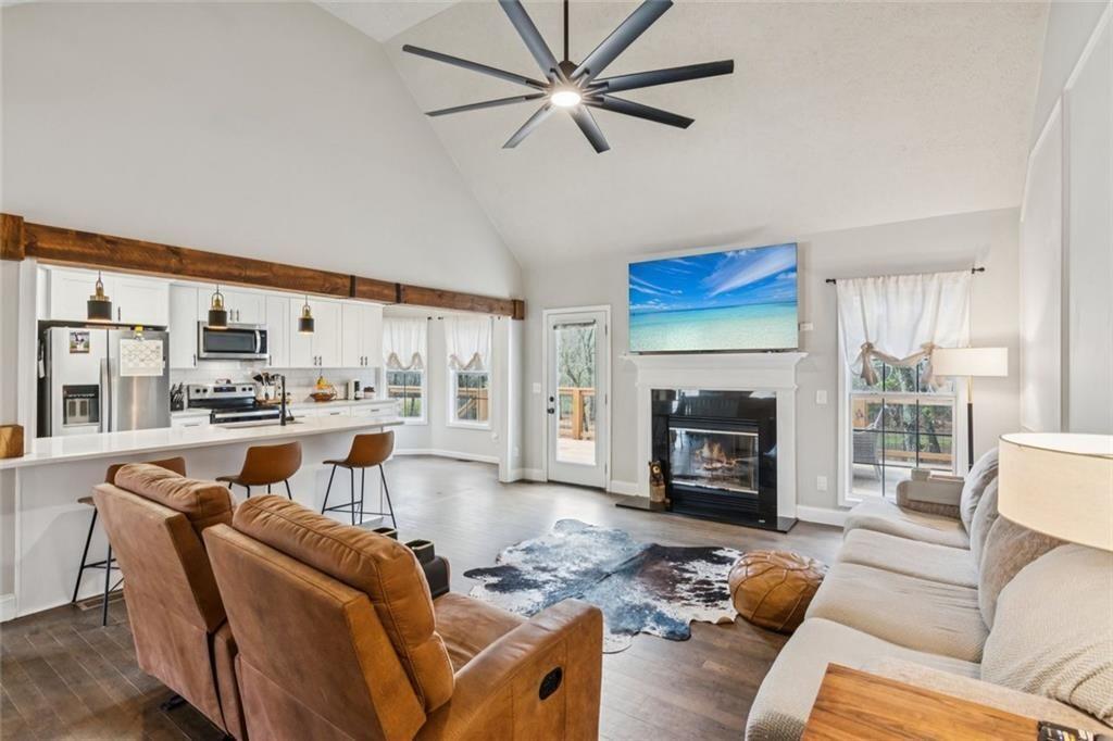 5595 Vaughn Road Woodstock, GA 30188 - Photo 7 of 42 a living room with furniture fireplace and a large window