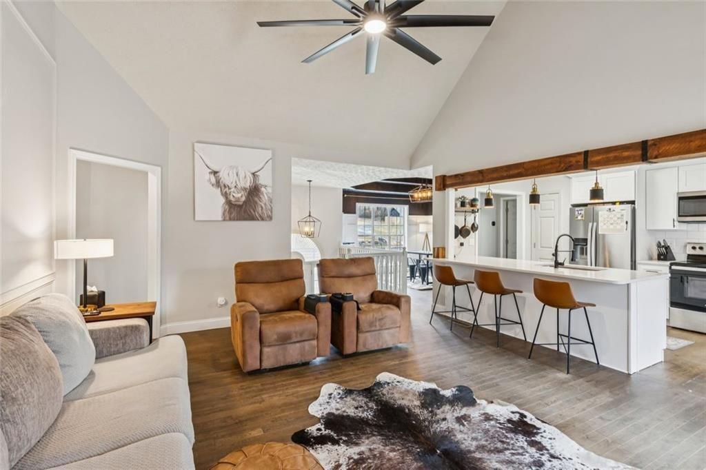 5595 Vaughn Road Woodstock, GA 30188 - Photo 10 of 42 a living room with furniture and a large window
