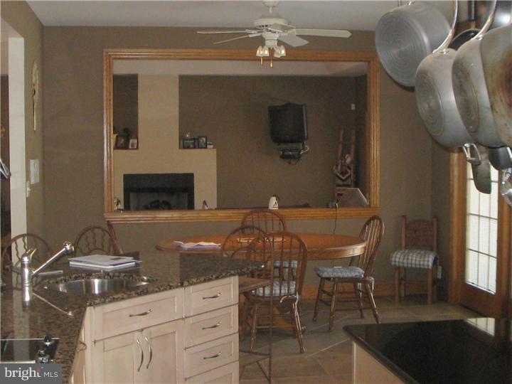 140 Patty Bowker Road Tabernacle, NJ 08088 - Photo 3 of 21 a kitchen with stainless steel appliances a stove a table and chairs